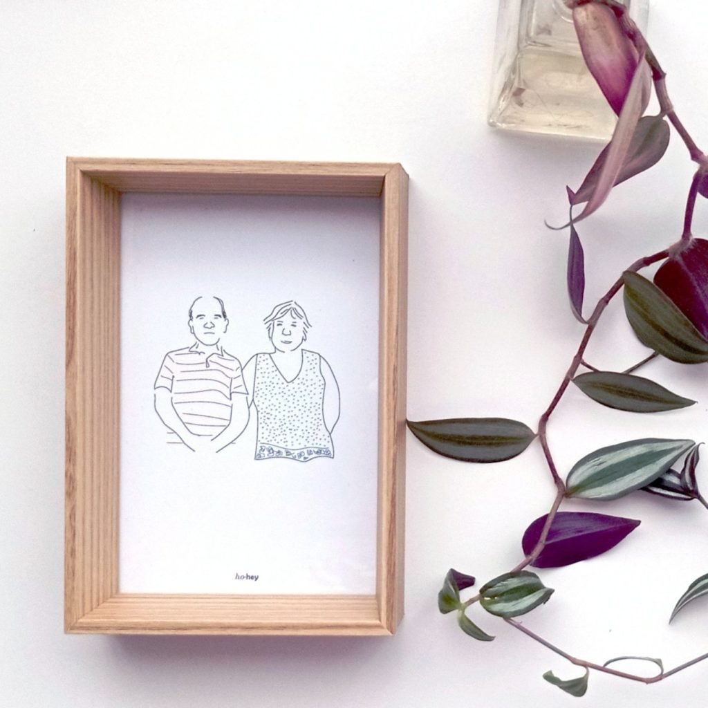 Ilustración personalizada a línea de una pareja, enmarcada en madera